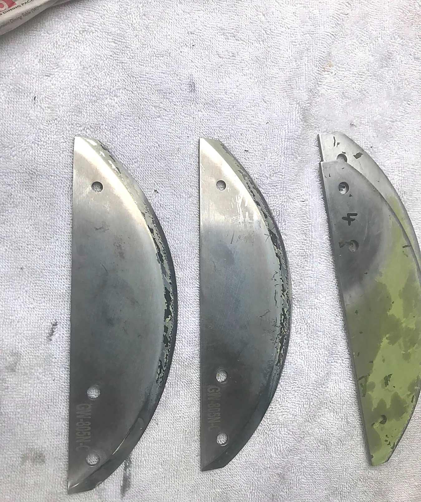 Industrial processor blades awaiting precision sharpening.