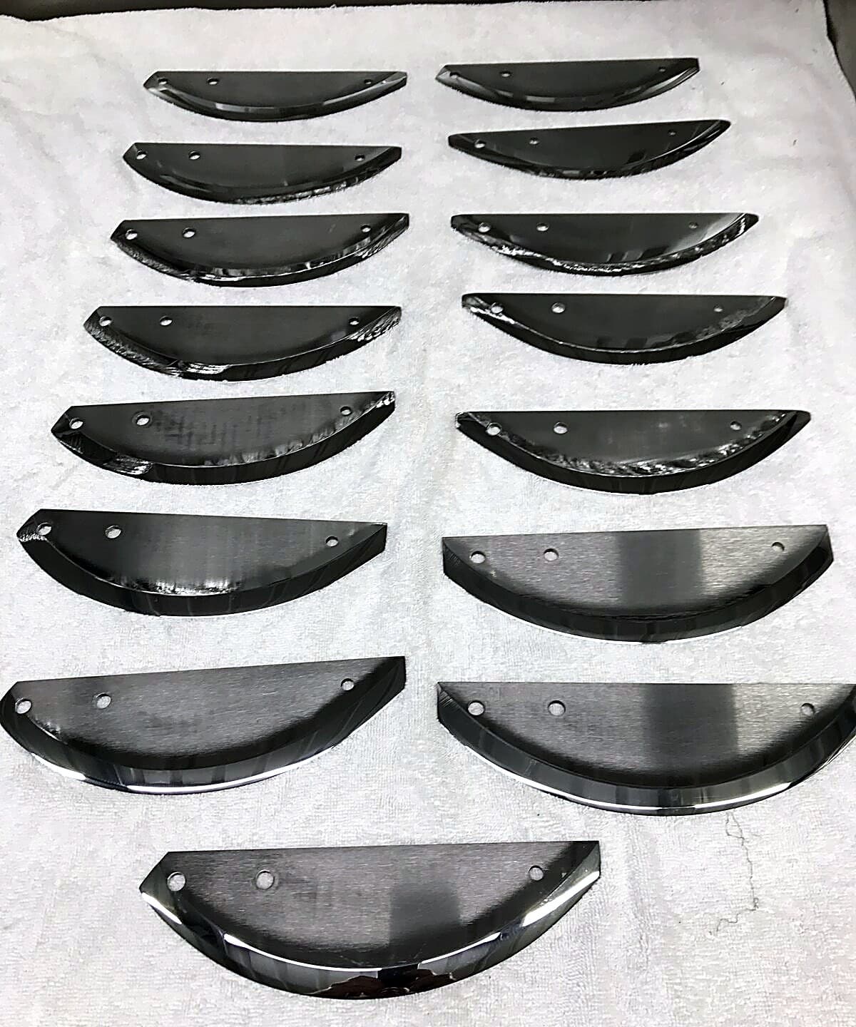 Industrial processor blades sharpened to a mirror finish for optimal cutting performance.